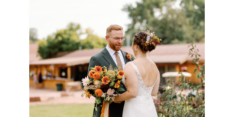Groom boutonniere with white flowers and greenery, Boulder CO wedding